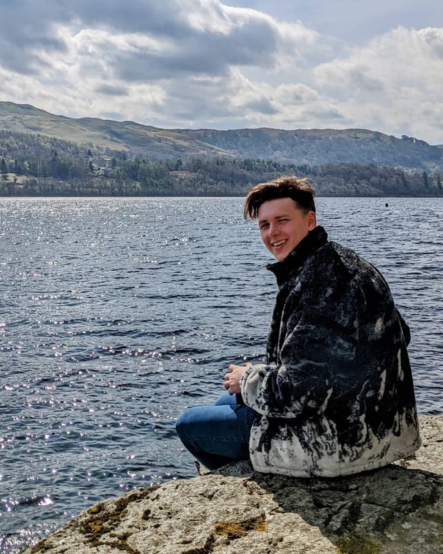 Theo Clapperton, Founder of Clapperton Labs, beside a Scottish loch